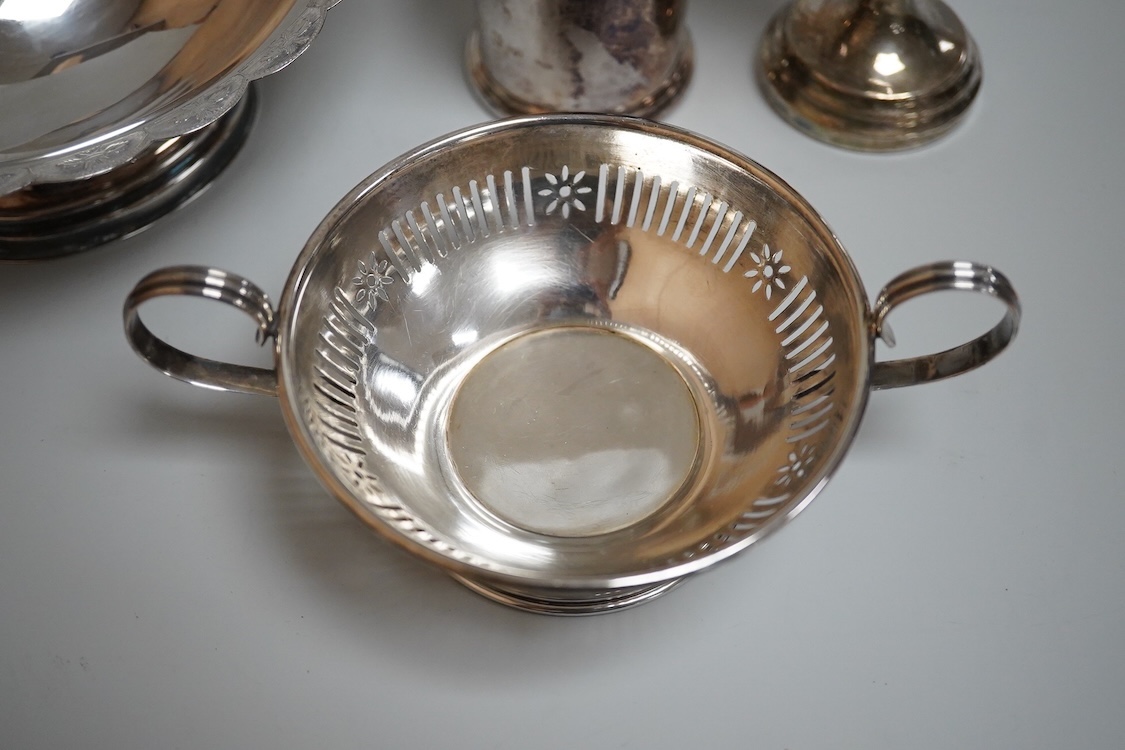 A modern silver oval pedestal sweetmeat bowl, by Mappin & Webb, Birmingham, 1987, 15.8cm, together with a small silver bottle holder, a silver mounted vase and a sterling two handled nut dish.